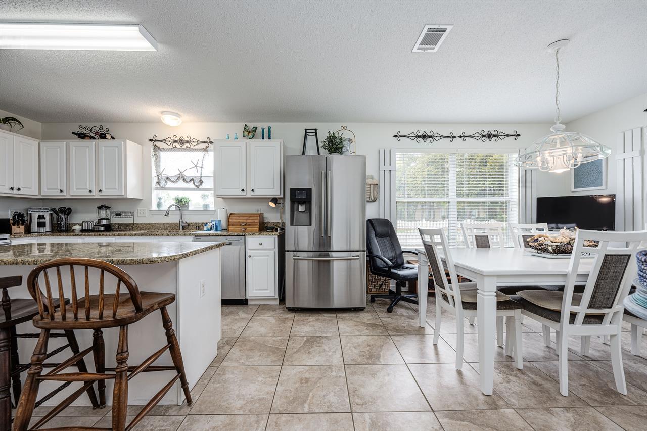 Dining table and kitchen area