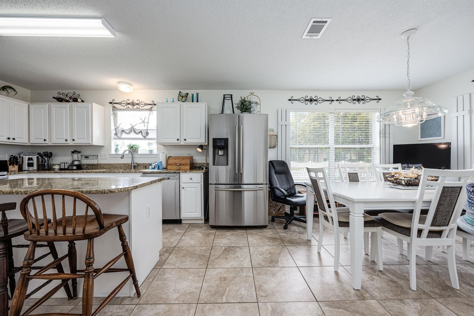 Dining table and kitchen area