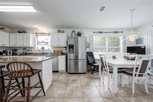 Dining table and kitchen area