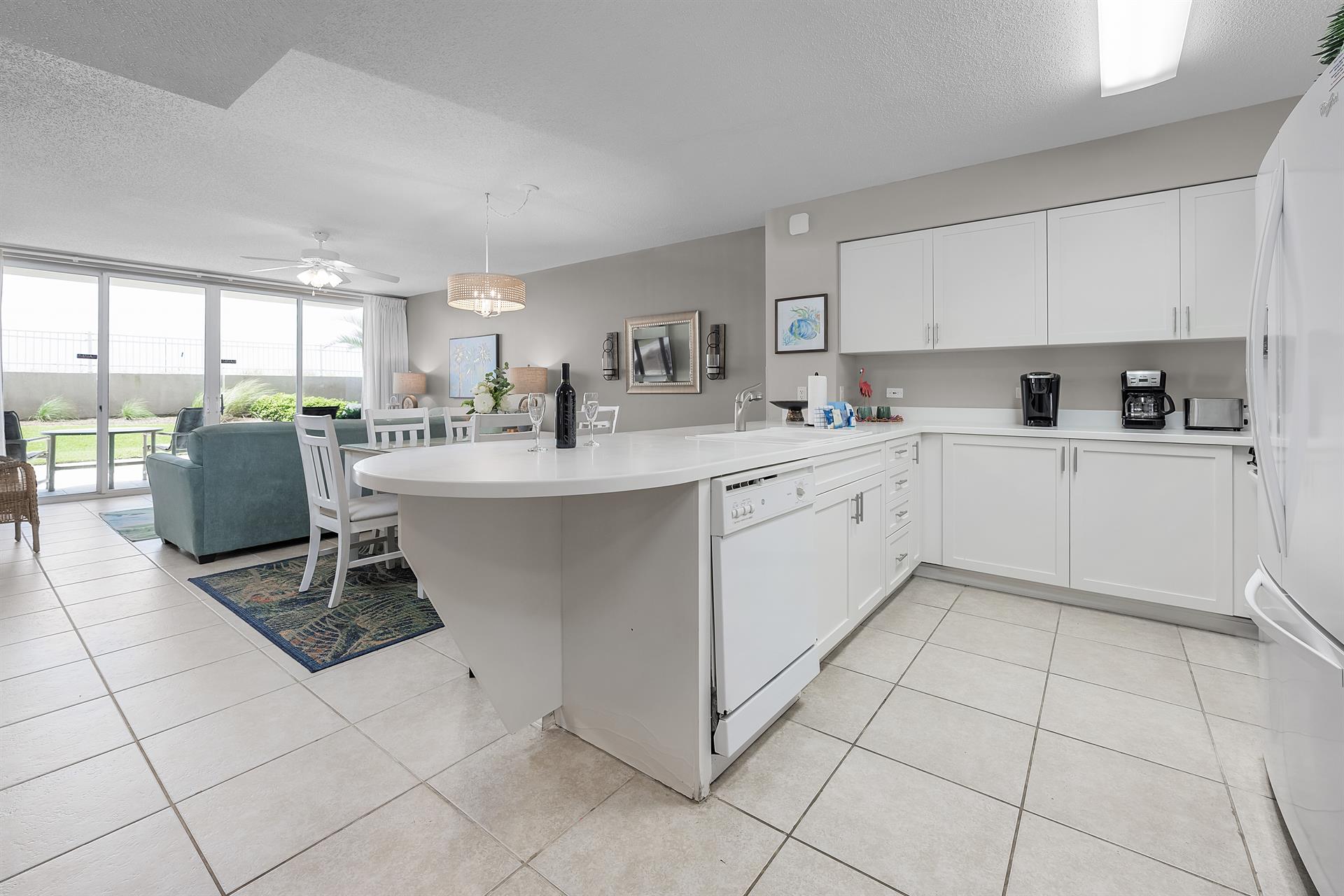 Kitchen view to dining and living rooms