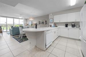 Kitchen view to dining and living rooms