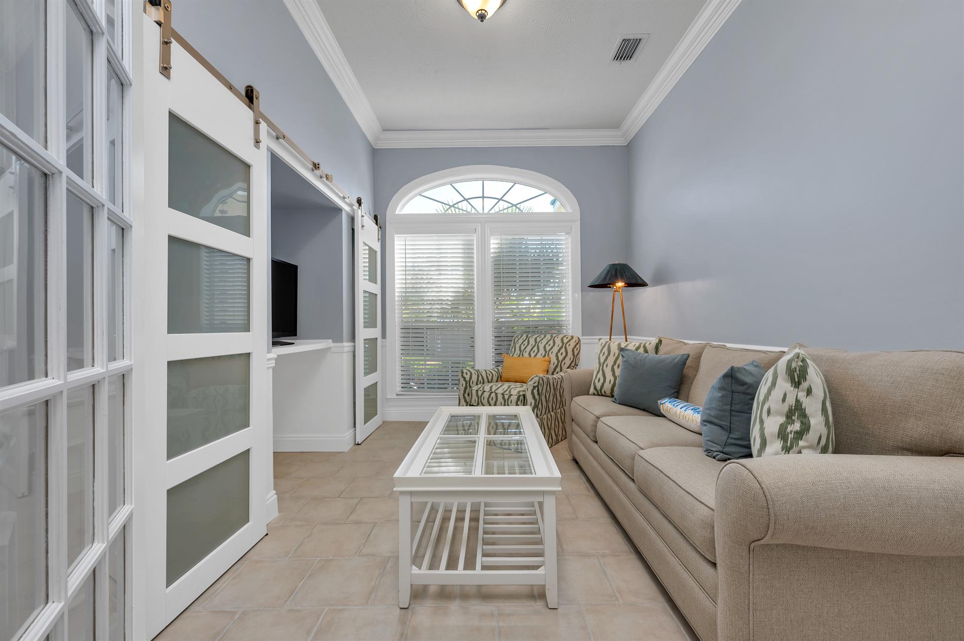Front room with sleeper sofa and TV