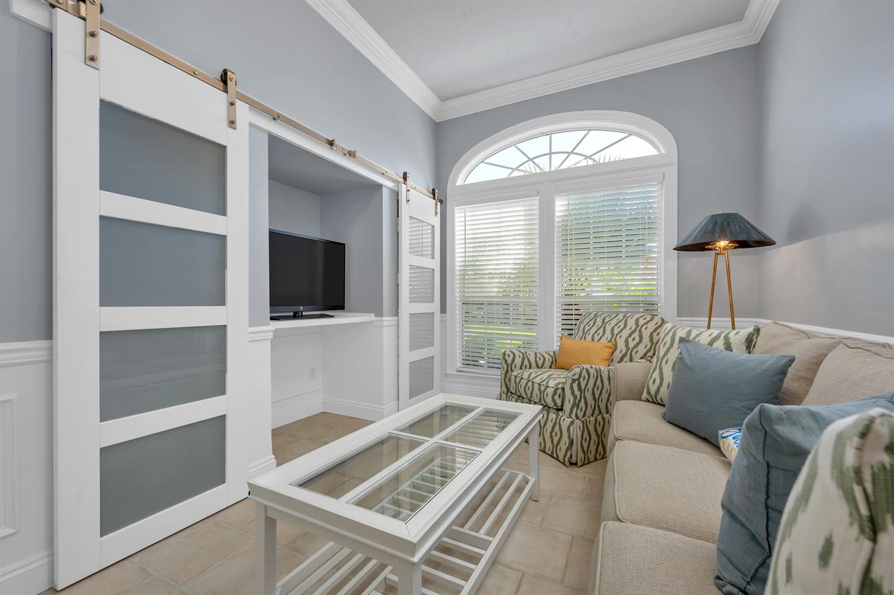 Front room with sleeper sofa and TV
