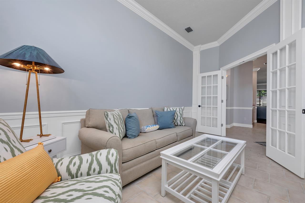 Front room with sleeper sofa and TV