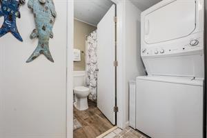 Laundry area and entry to downstairs bathroom