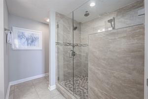 Inviting master bathroom walk in shower