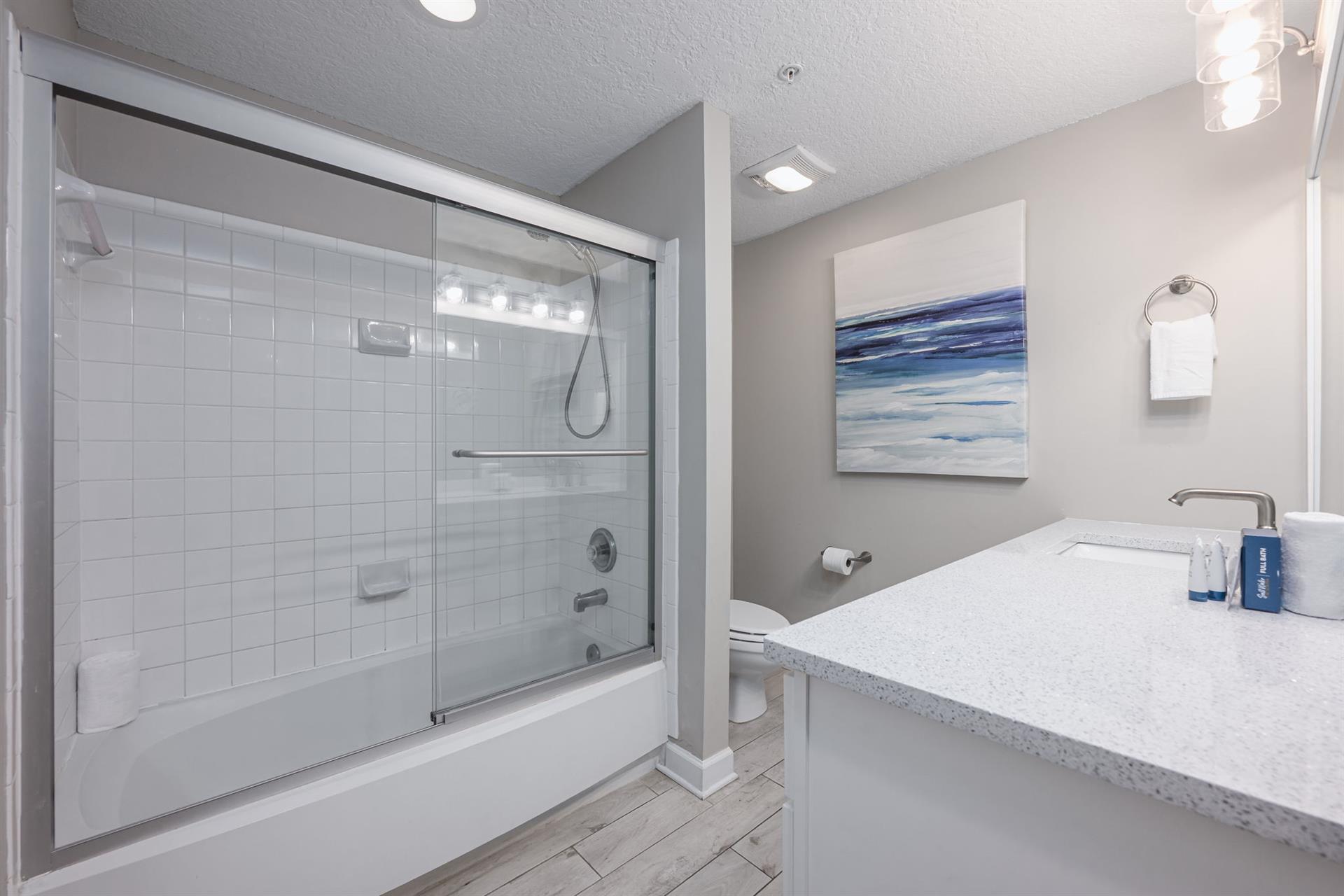 Guest bathroom with tub  shower combo