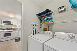 private washer  dryer right off the kitchen