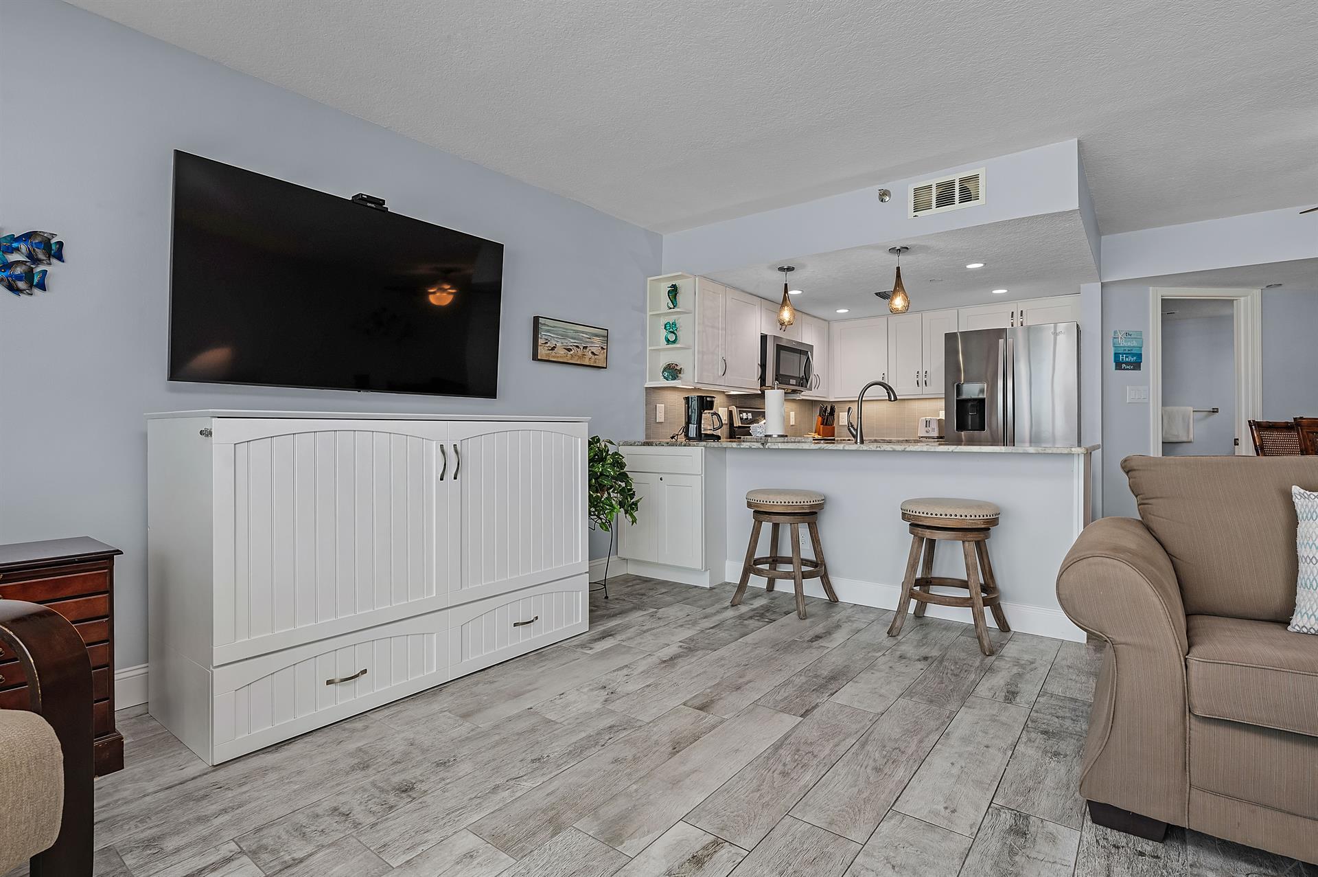 Living Area with Hidden Dresser Bed