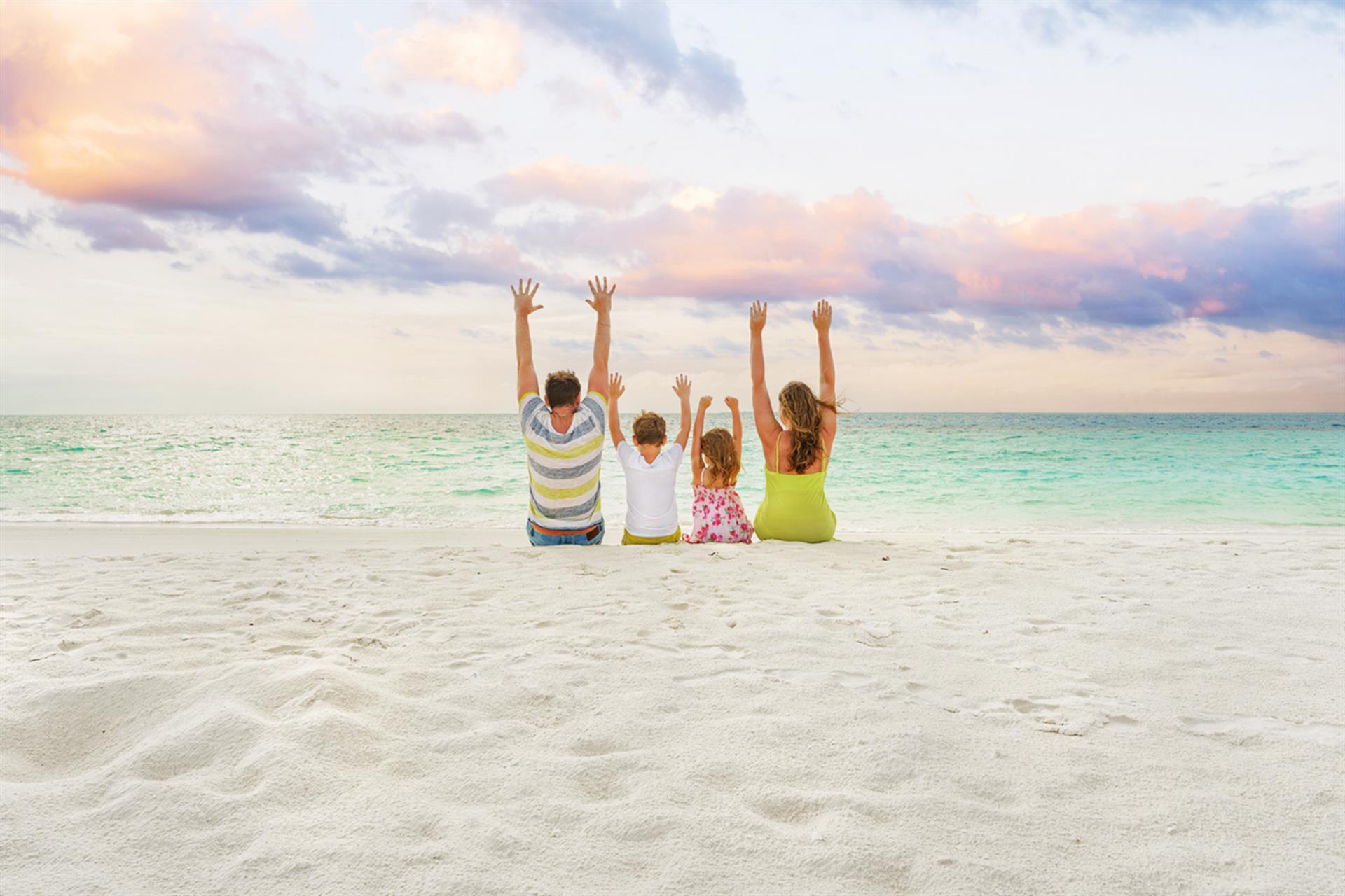 family on white sand