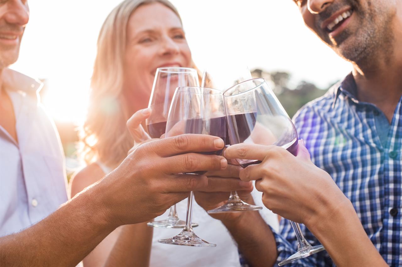 Friends with wine on beach