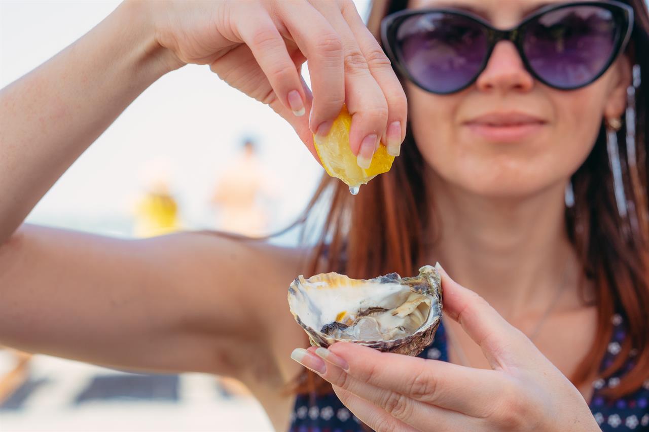 Woman eating seafood