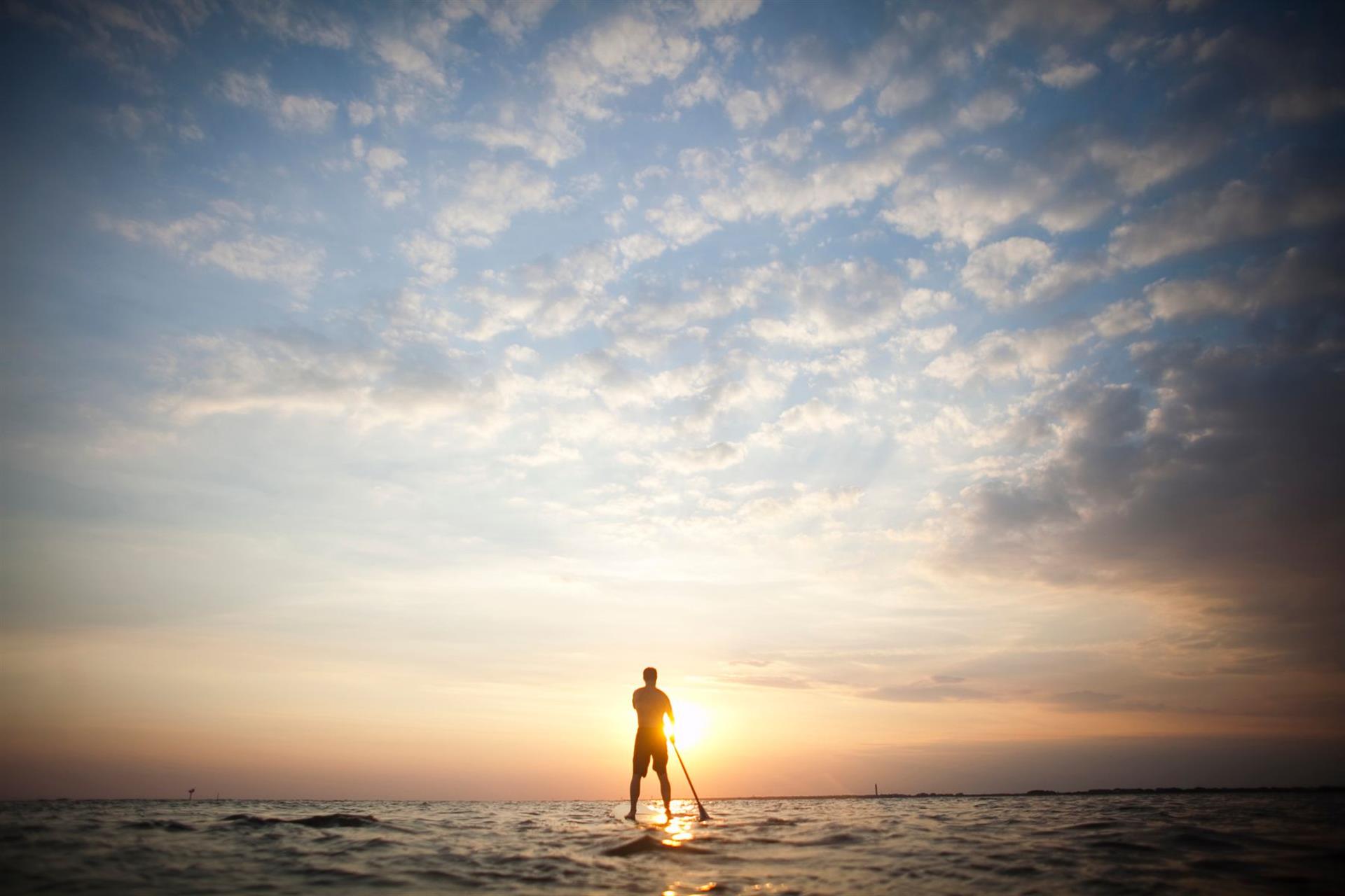 Paddleboarder at sunset