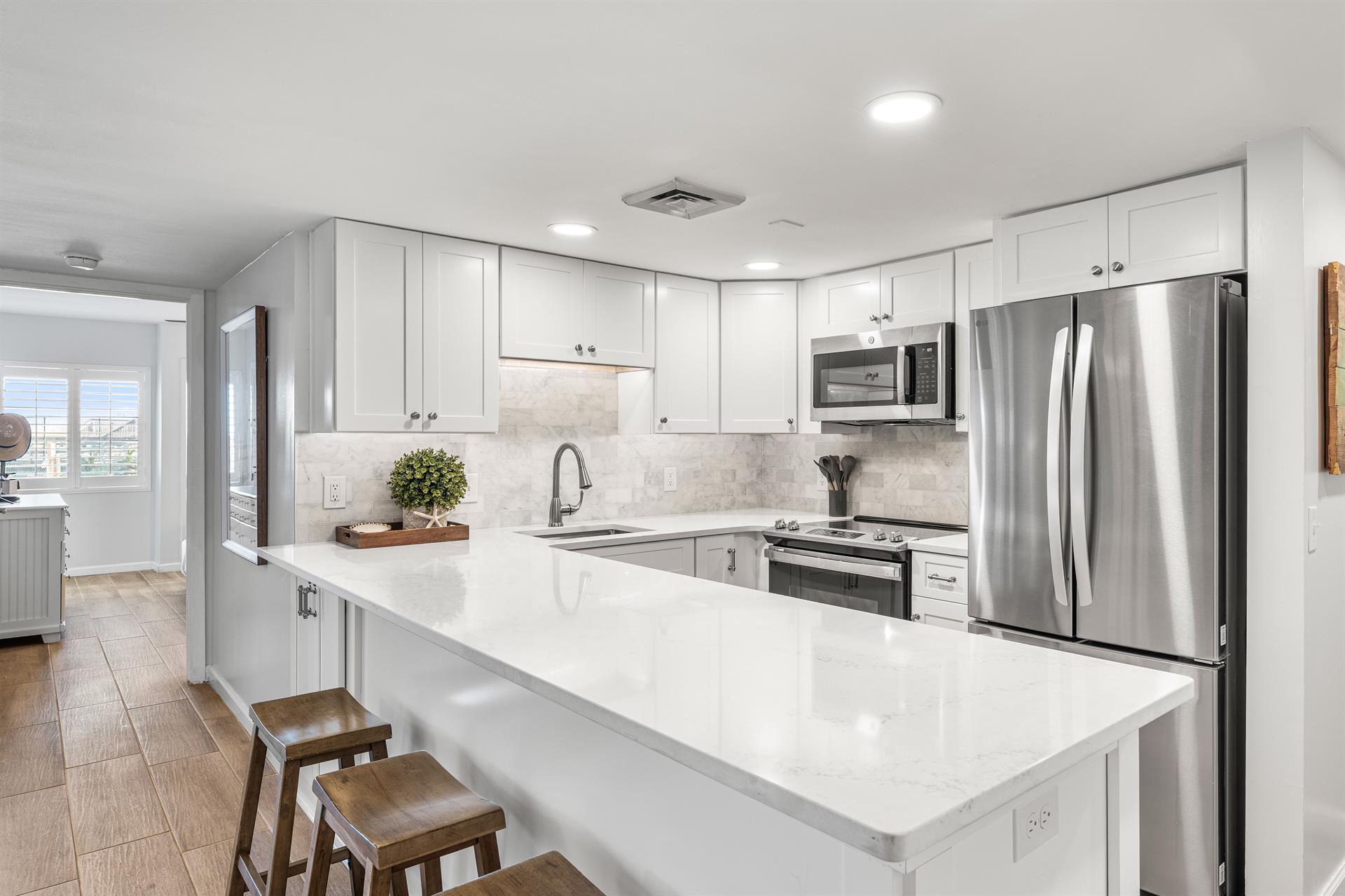 Fully renovated kitchen with stainless appliances, ready for fam