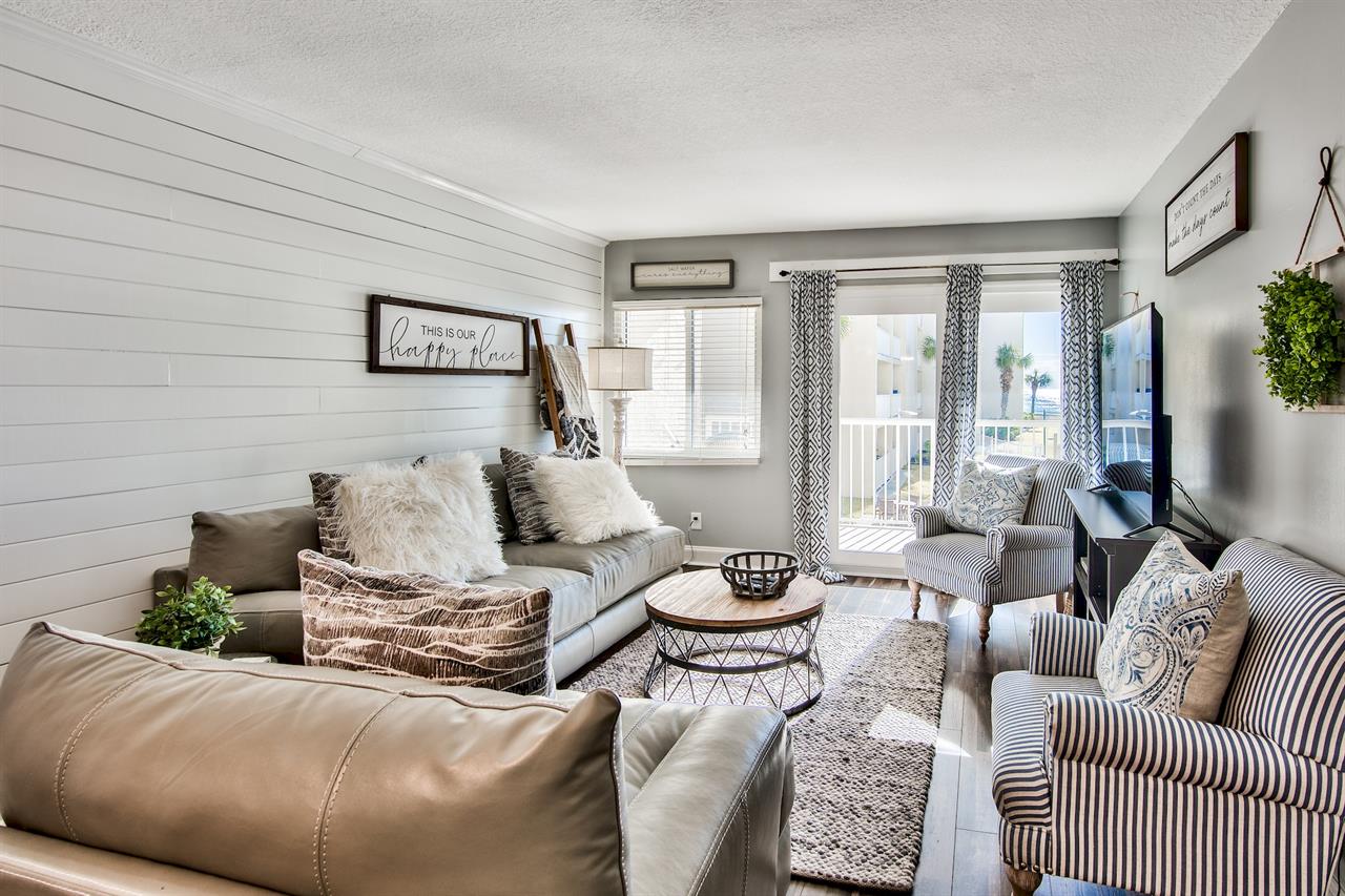 HSRC 211 Living Area with Sofa Sleeper  Balcony Access