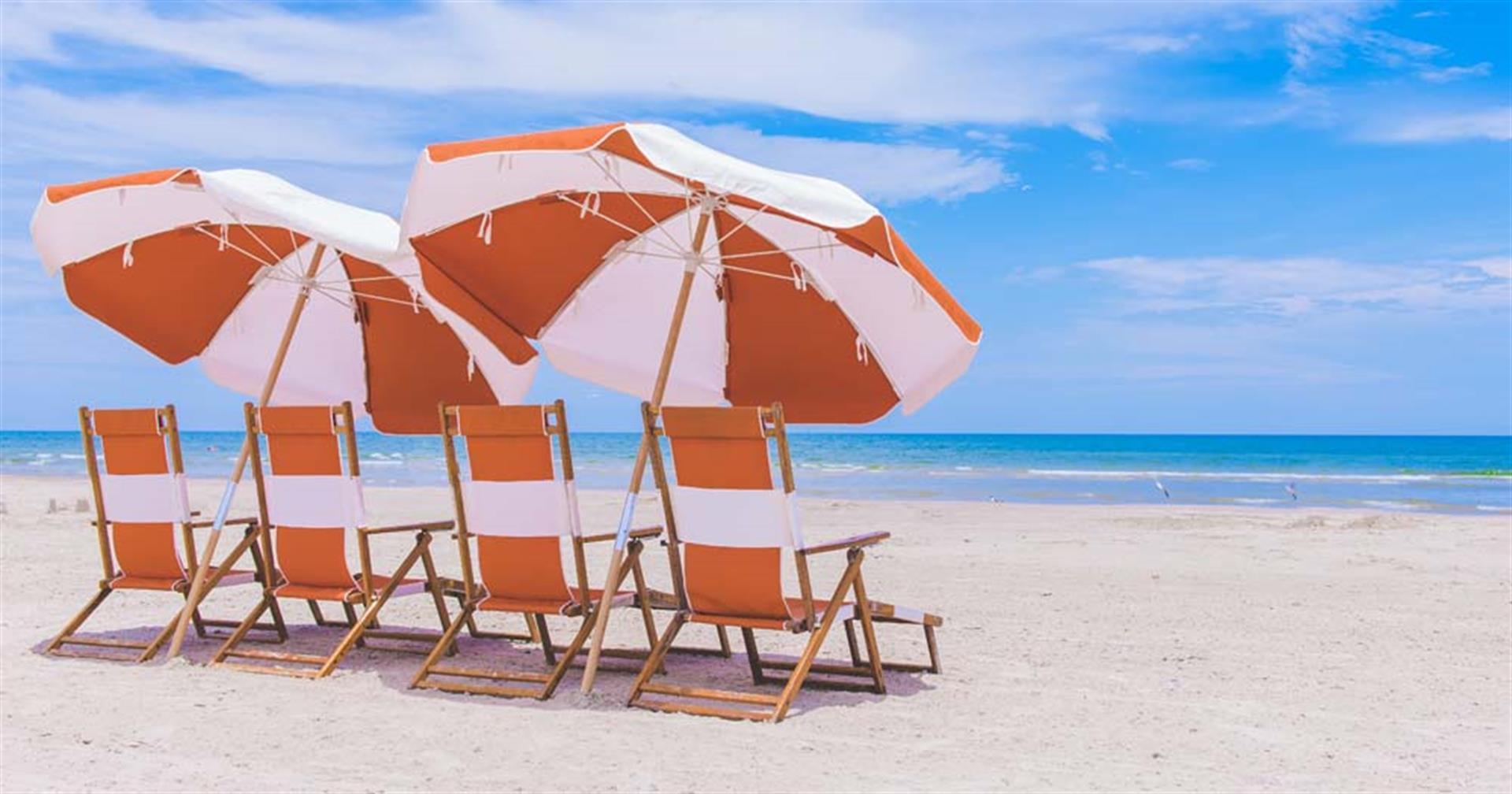 Beach chairs and umbrella at Cinnamon Shore