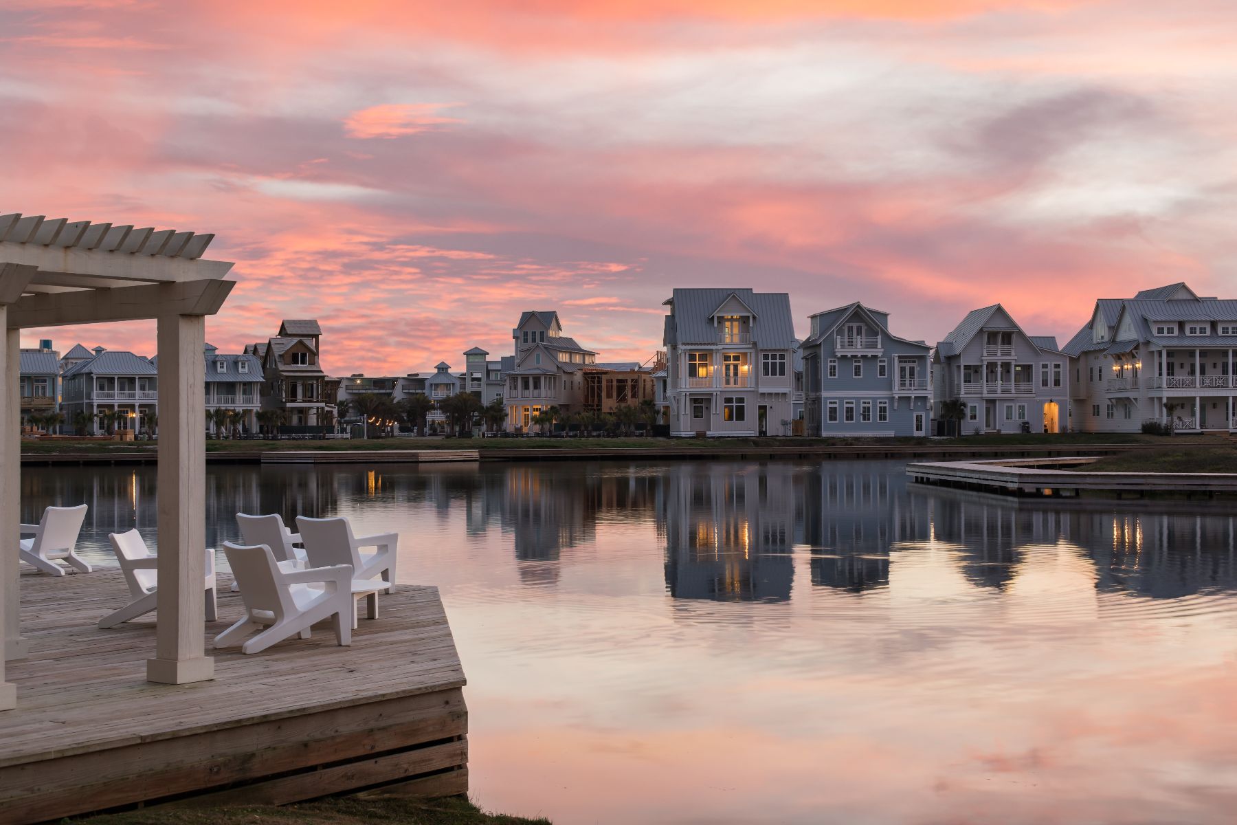Sunset over lakefront homes at Cinnamon Shore in Port Aransas, Texas