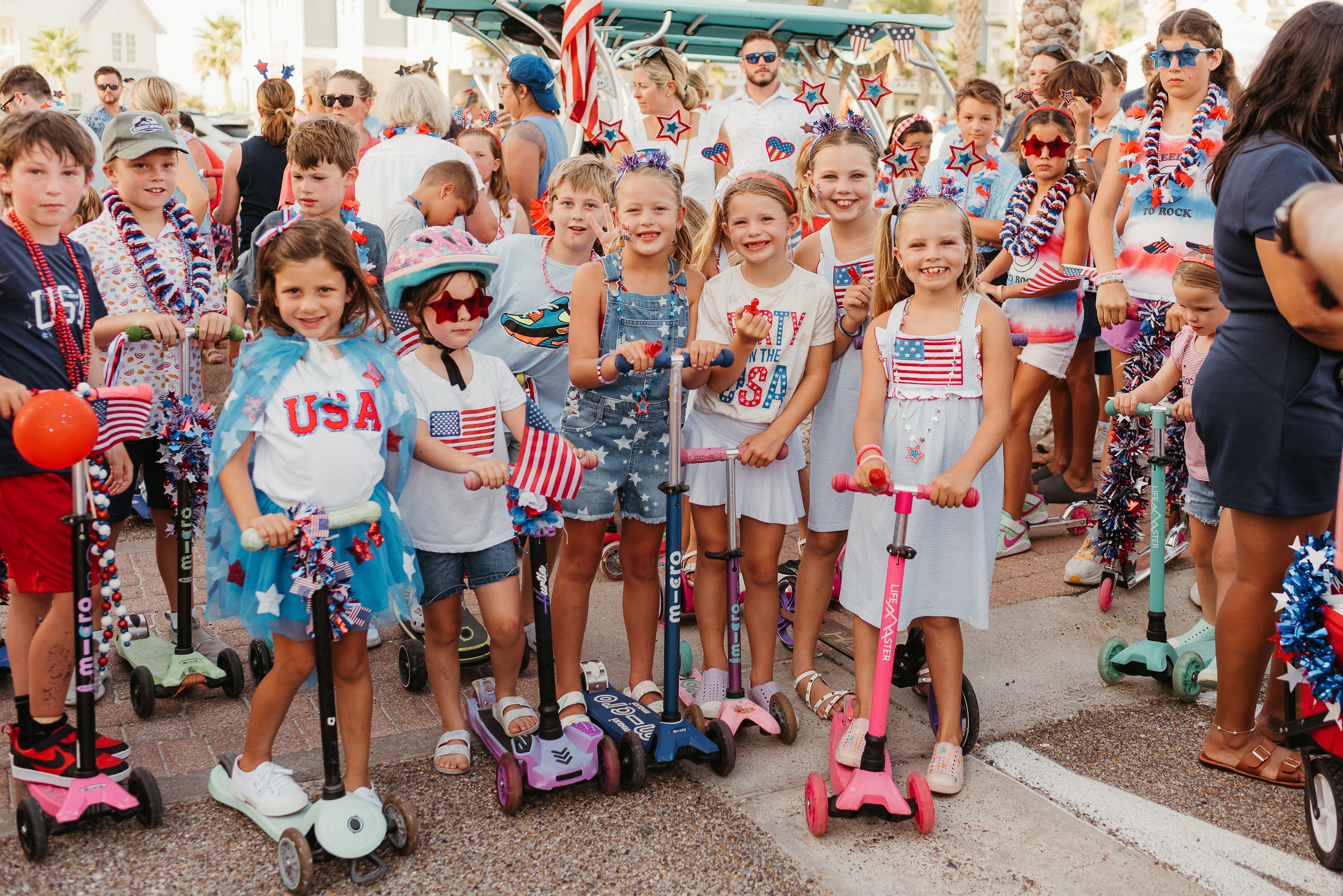Kids riding decorated bikes during the All-American Bike Parade at Cinnamon Shore