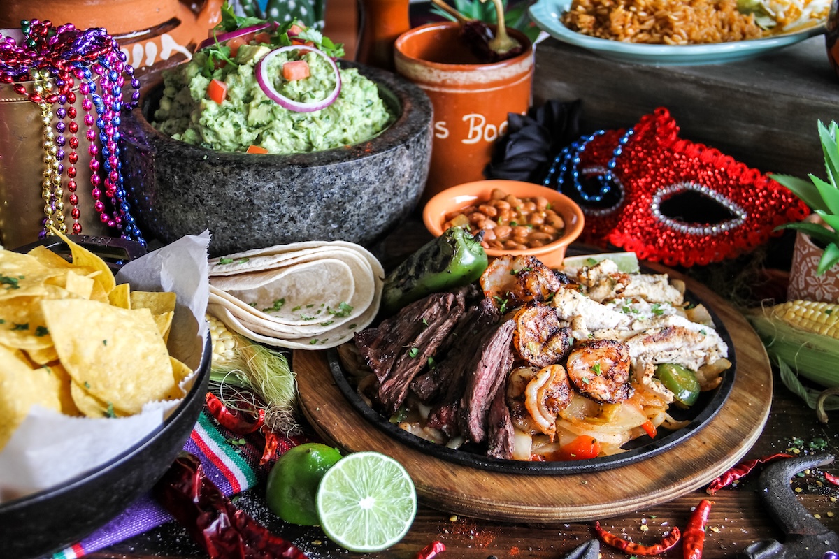 Fajitas, shrimp, steak, guacamole, tortillas, and Tex-Mex sides from Dos Bocas for a poolside food preview at Cinnamon Shore in Port Aransas, Texas