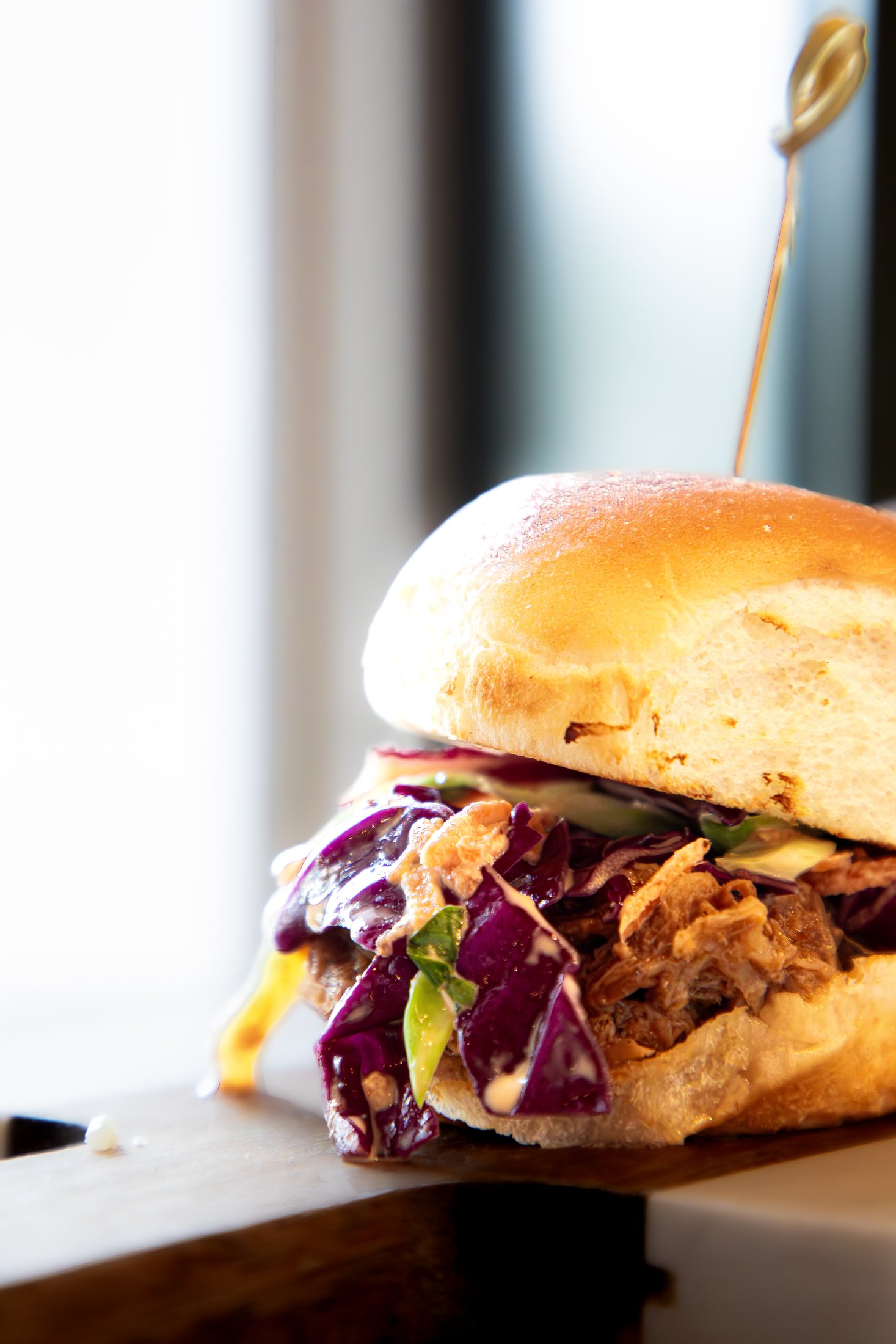 Close-up of a Tiki Jay's coastal slider with island slaw at Cinnamon Shore in Port Aransas