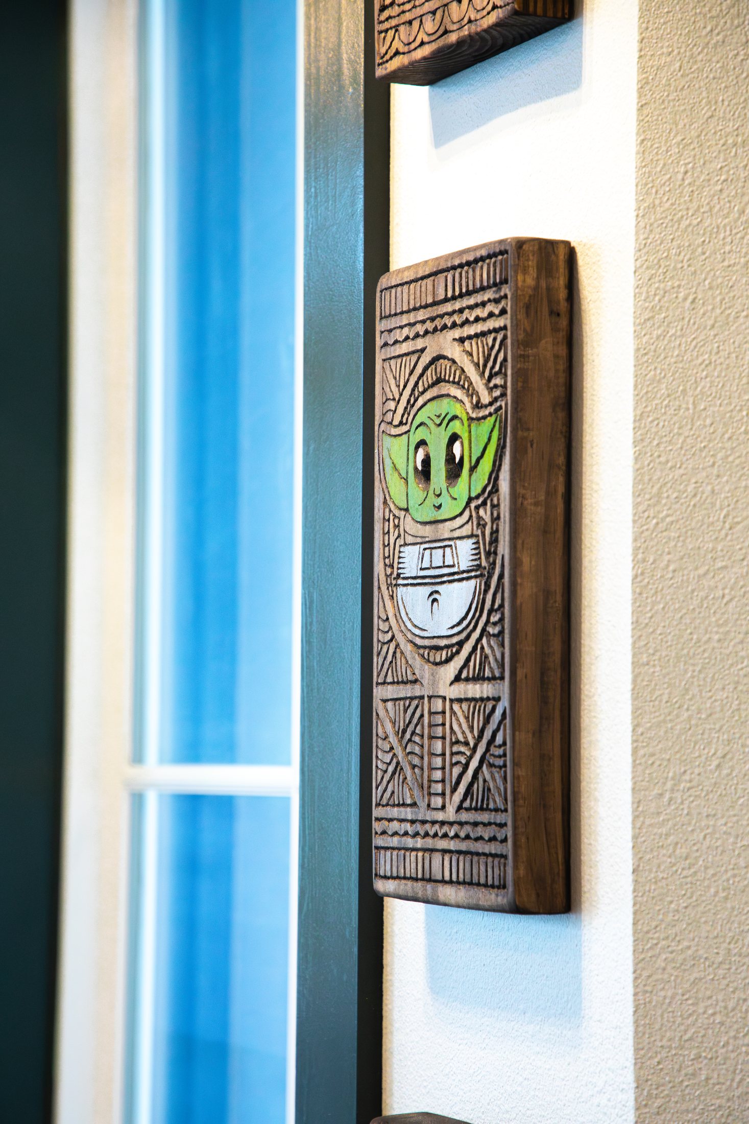Carved tiki wall art inside Tiki Jay's at Cinnamon Shore