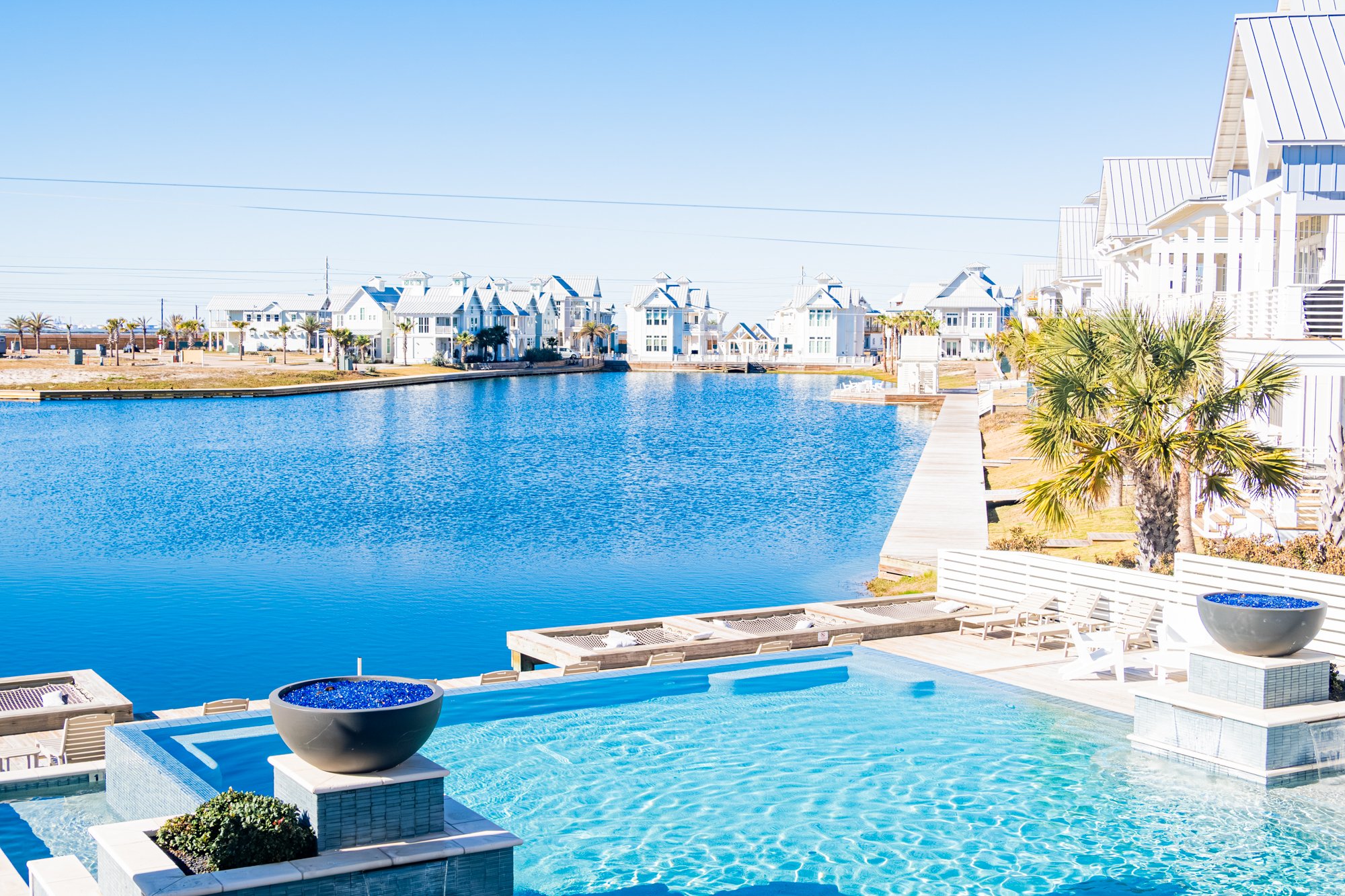 Cabana Pool at Cinnamon Shore South with waterfront views and bright coastal pool seating