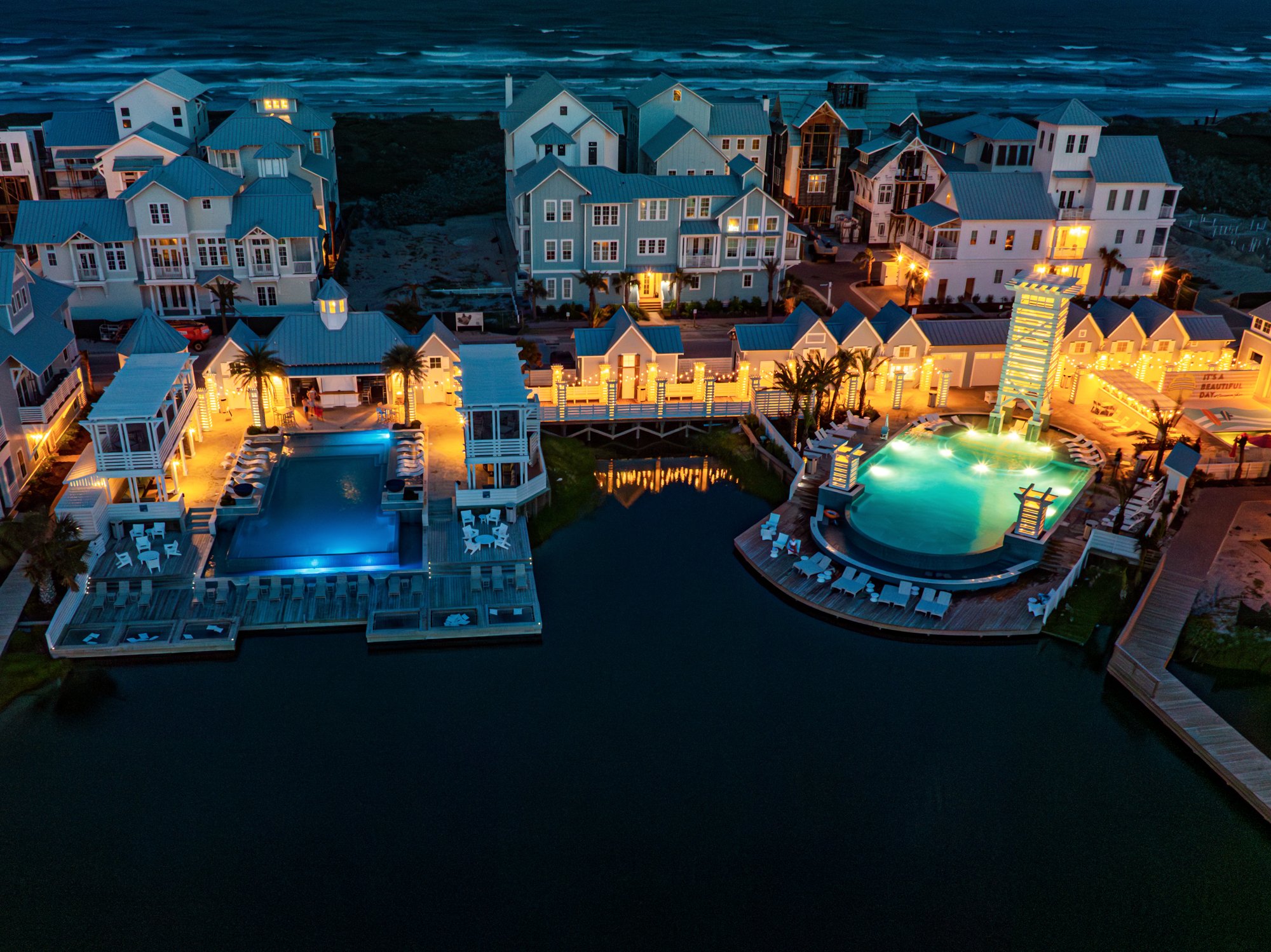 Aerial dusk view of Cabana Pool and Splish Splash Family Pool at Cinnamon Shore South