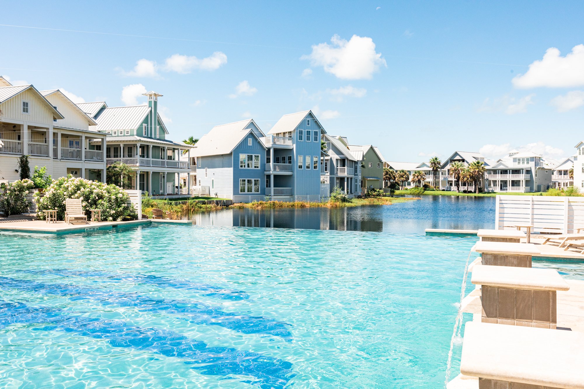 Keira's Pool at Cinnamon Shore North in Port Aransas, Texas, with coastal homes and bright pool water