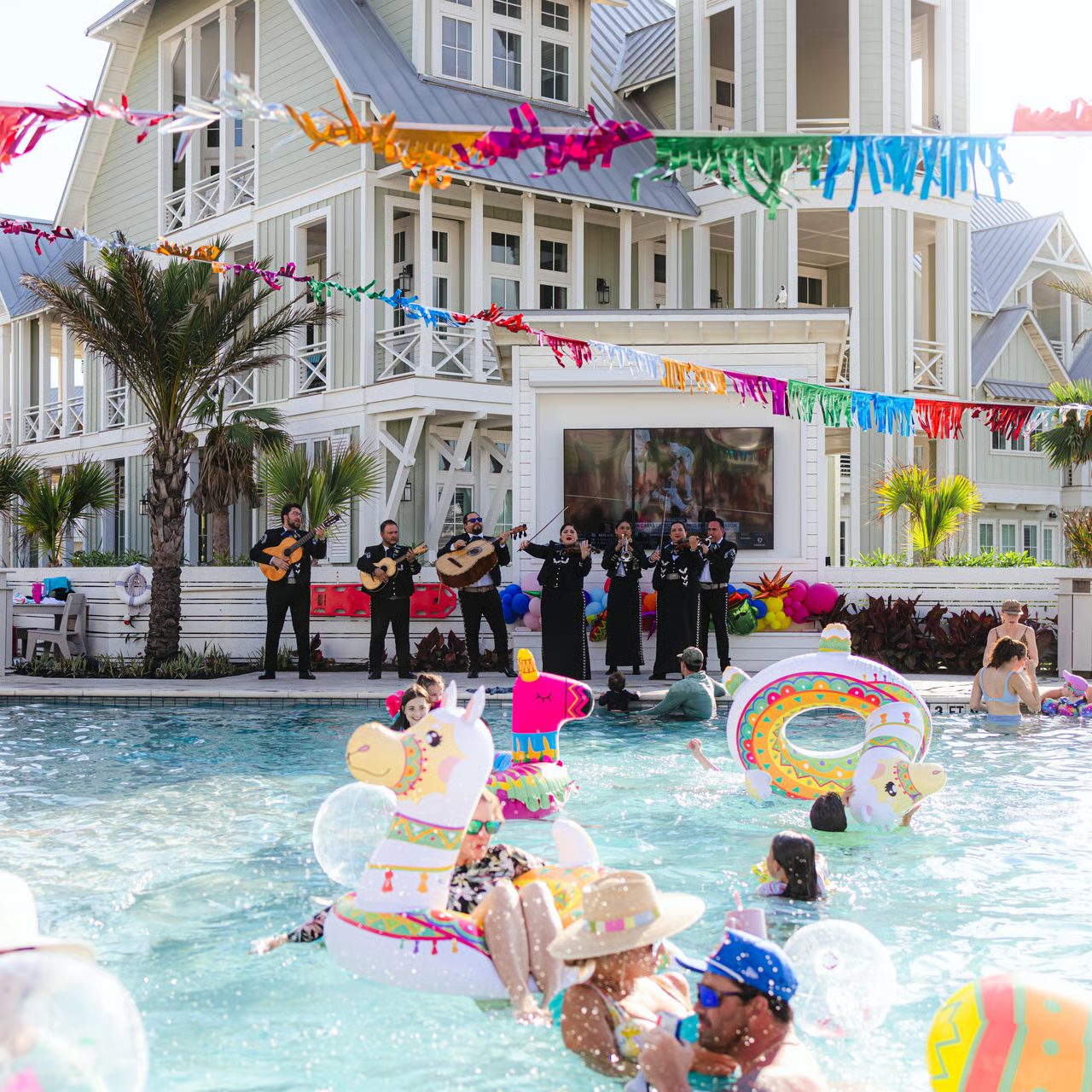 Group celebration by the pool at Cinnamon Shore, a Texas Coast vacation community in Port Aransas