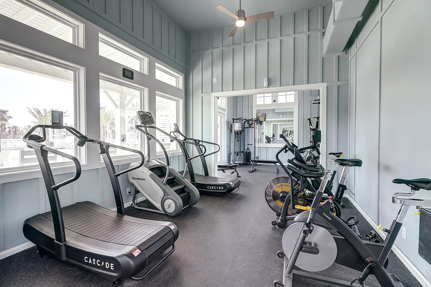 Fitness Center at Dune Pool cardio room with treadmill, indoor bikes, and strength equipment at Cinnamon Shore North.