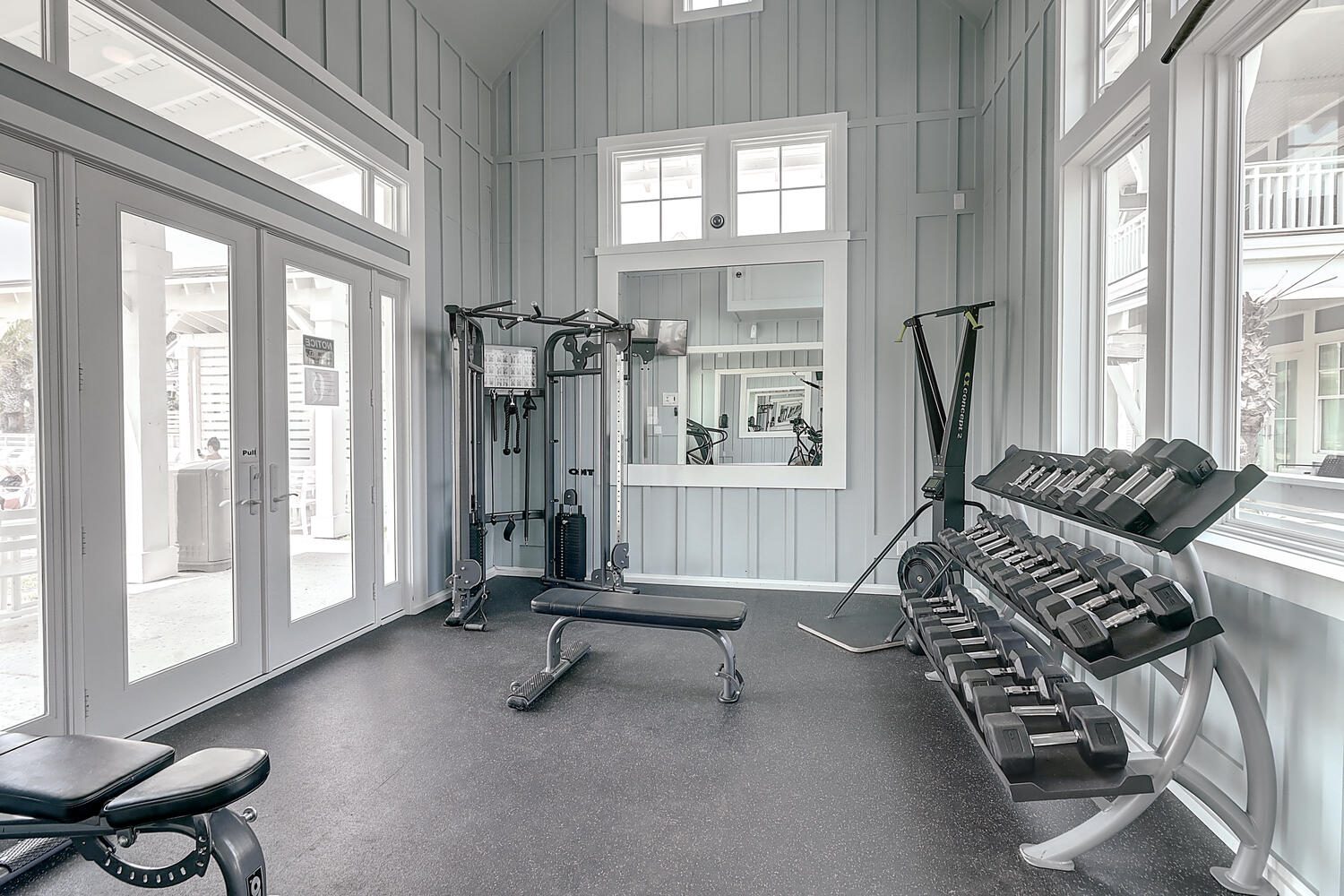 Fitness Center at Dune Pool strength equipment, free weights, bench, and cable machine at Cinnamon Shore North.