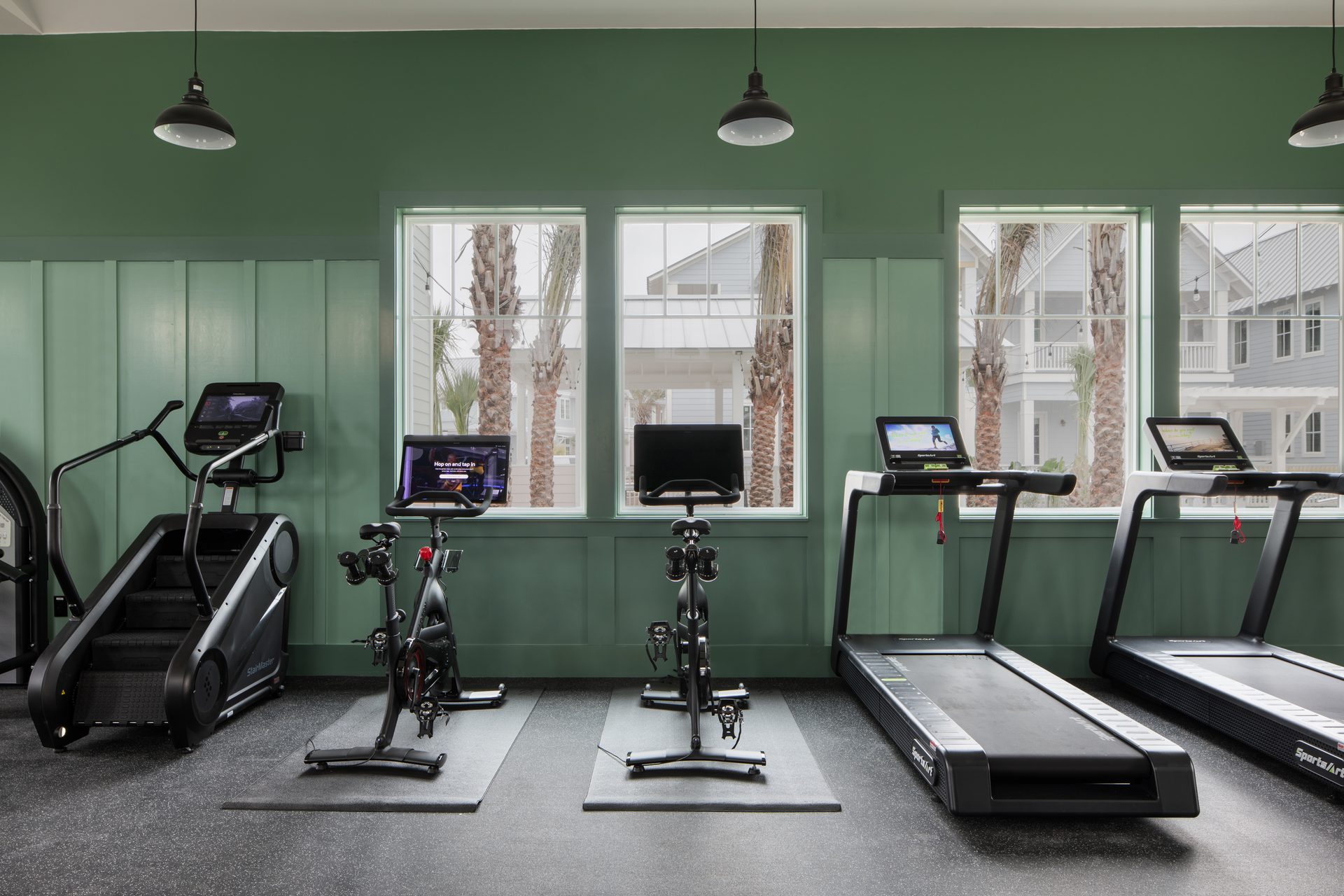 Glow Pool Fitness Center with cardio equipment, Peloton bikes, and treadmills at Cinnamon Shore South