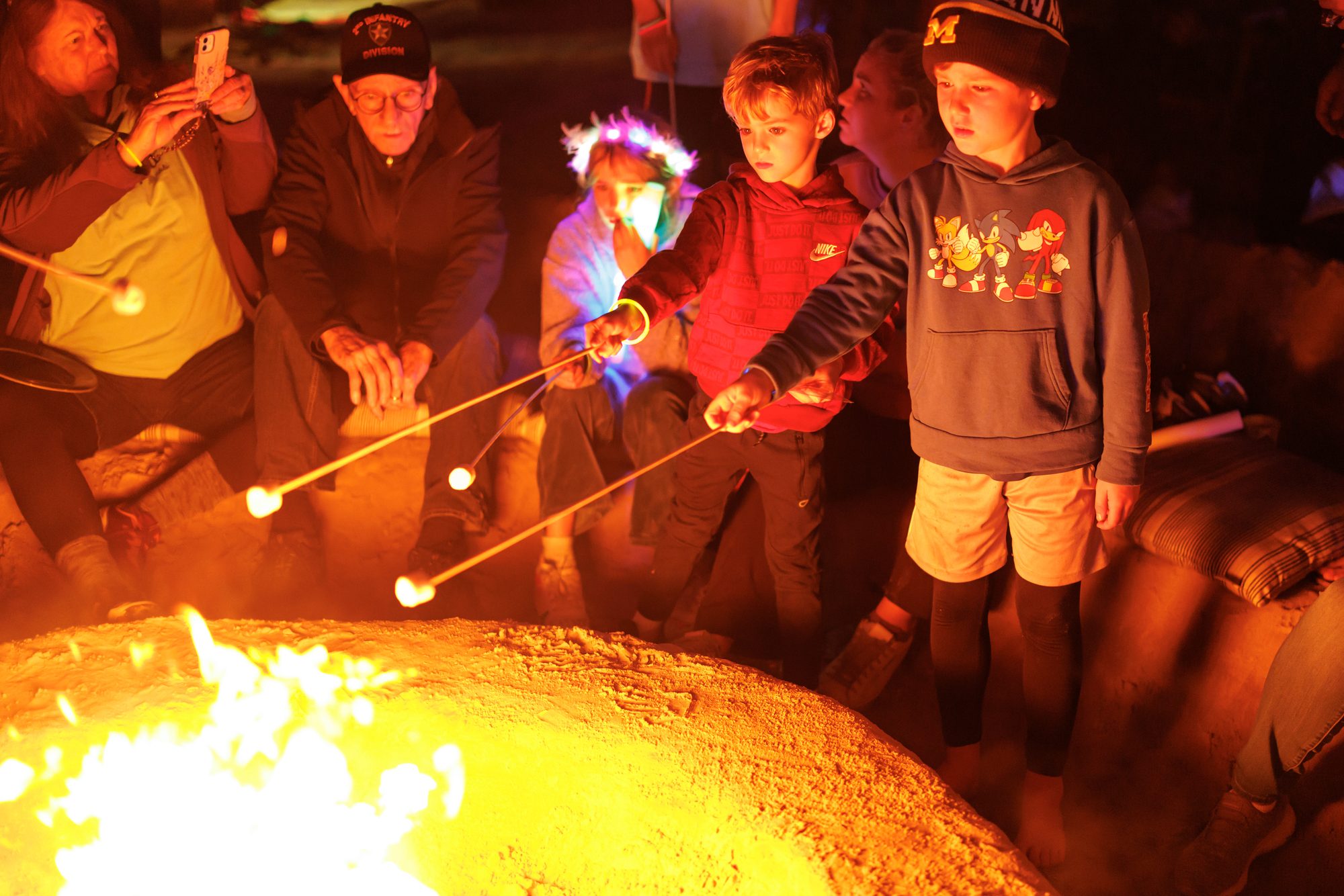 Kids roasting marshmallows at the beach bonfire during New Year&rsquo;s Eve at Cinnamon Shore in Port Aransas, Texas