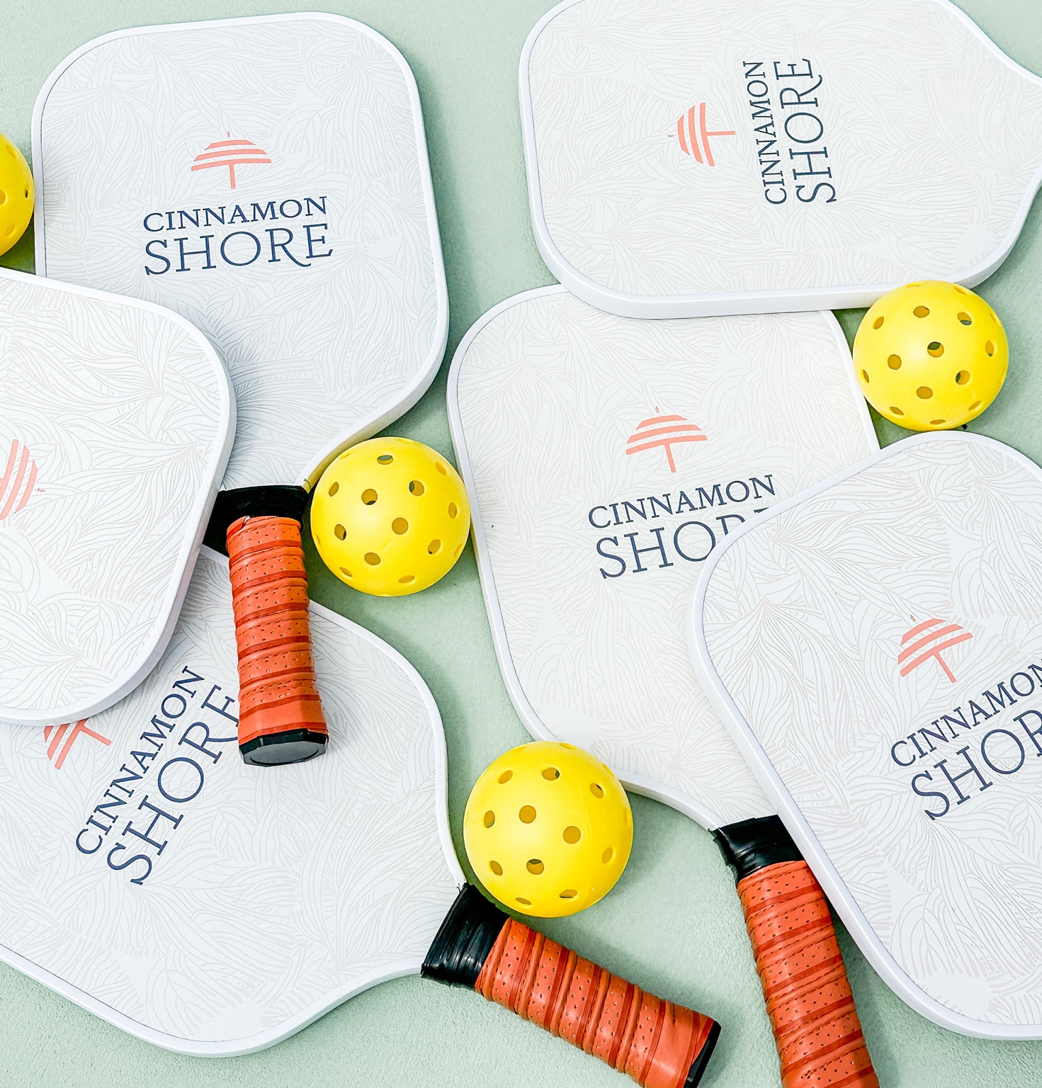 Pickleball paddles and balls at the new Seascape Courts at Cinnamon Shore South