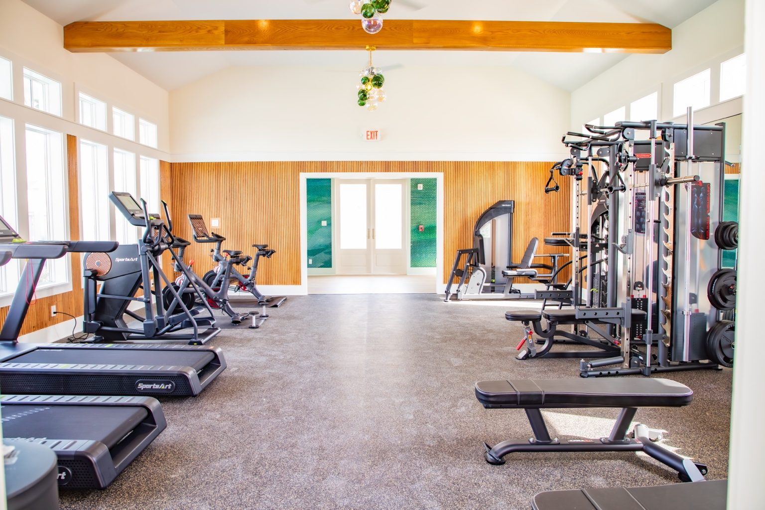 Sea Glass Fitness Center cardio and strength room with treadmills, bikes, and weight training equipment at Cinnamon Shore.