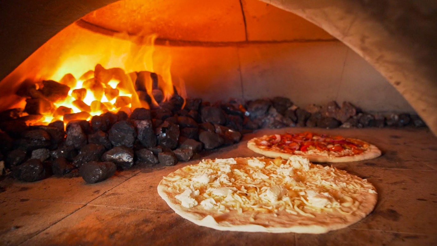 Pizzas baking in the oven at Dylan's Pizzeria