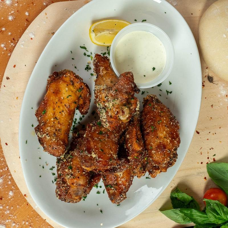 Crispy chicken wings served with ranch dipping sauce and lemon at Dylan's