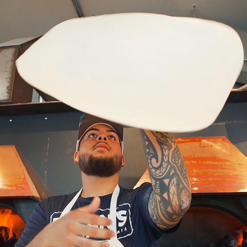 Dylan's pizza chef tossing fresh dough