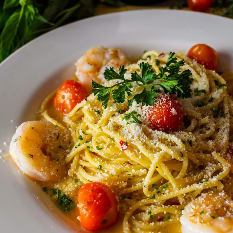 Shrimp pasta with cherry tomatoes, herbs, and parmesan at Dylan's