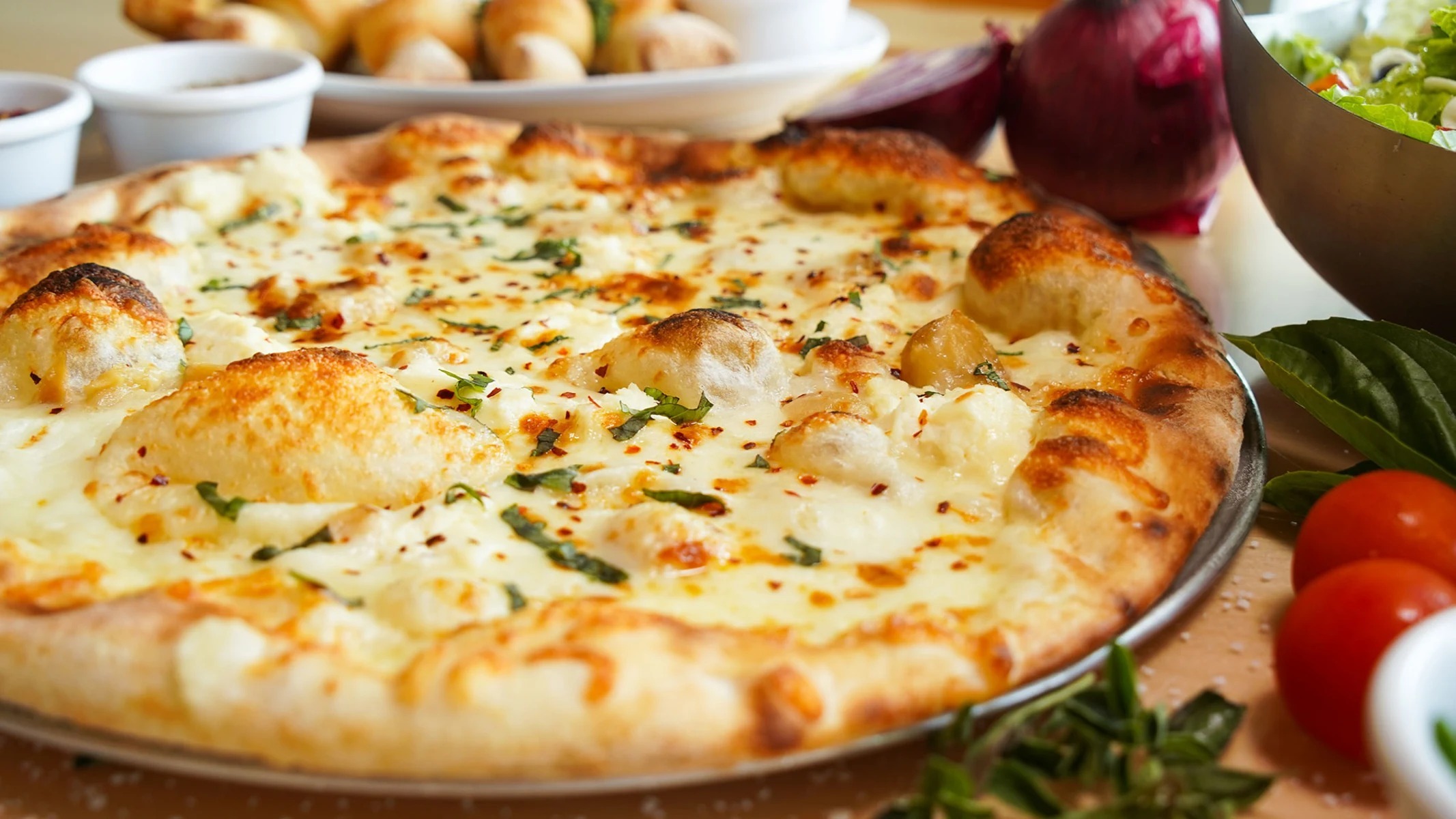 Dylan's white pizza with melted cheese, herbs, and a golden crust