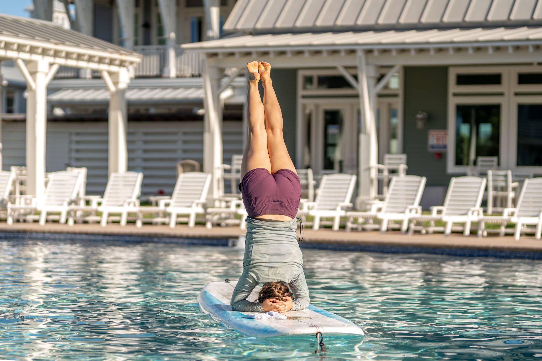 paddleboard yoga headstand cinnamon shore