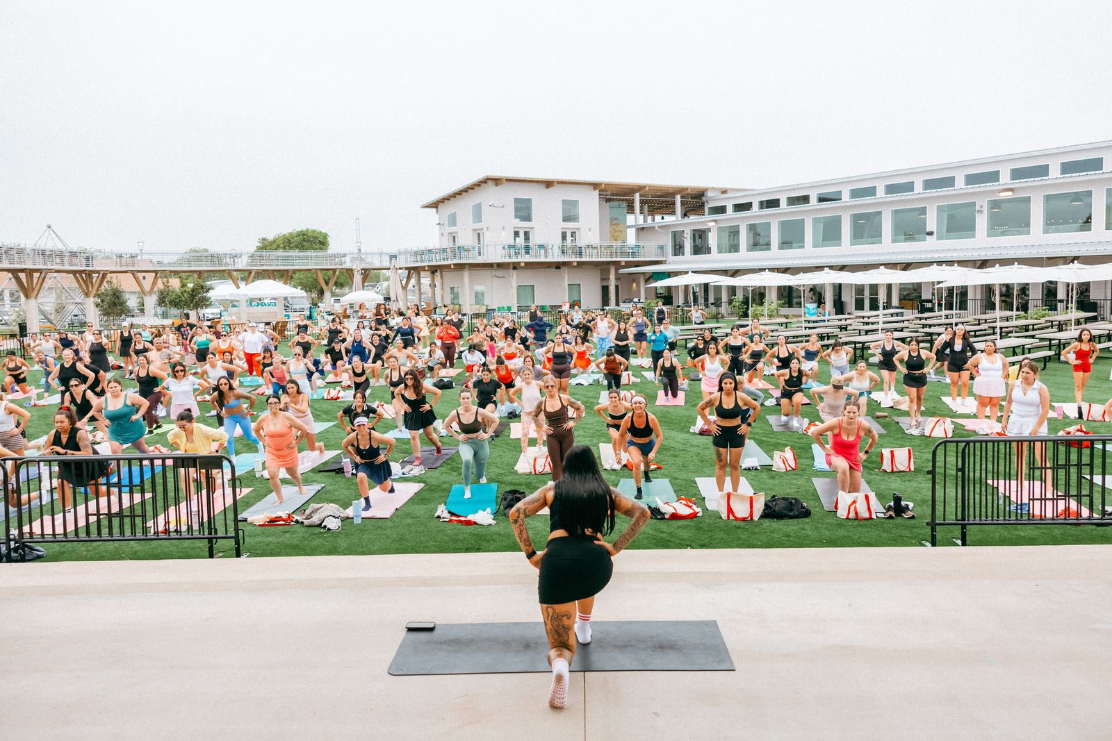 Guests taking a sculpt class on the lawn at the LŪMA Seaside Social at Cinnamon Shore North