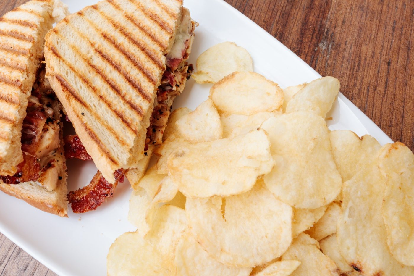 Chicken bacon panini with chips from Shore Cafe at Cinnamon Shore