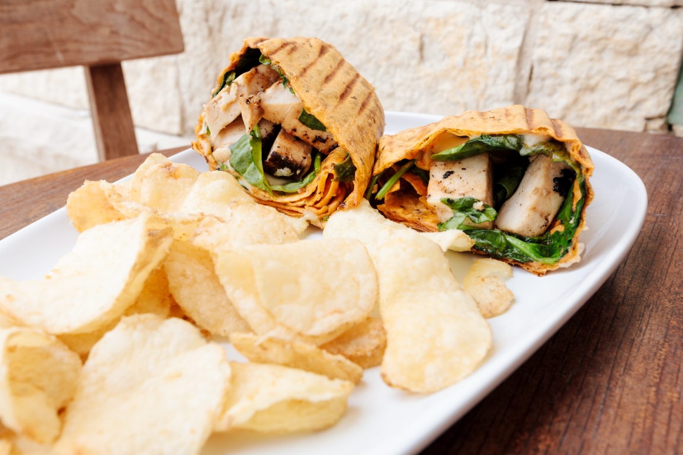 Grilled chicken wrap with chips from Shore Cafe at Cinnamon Shore