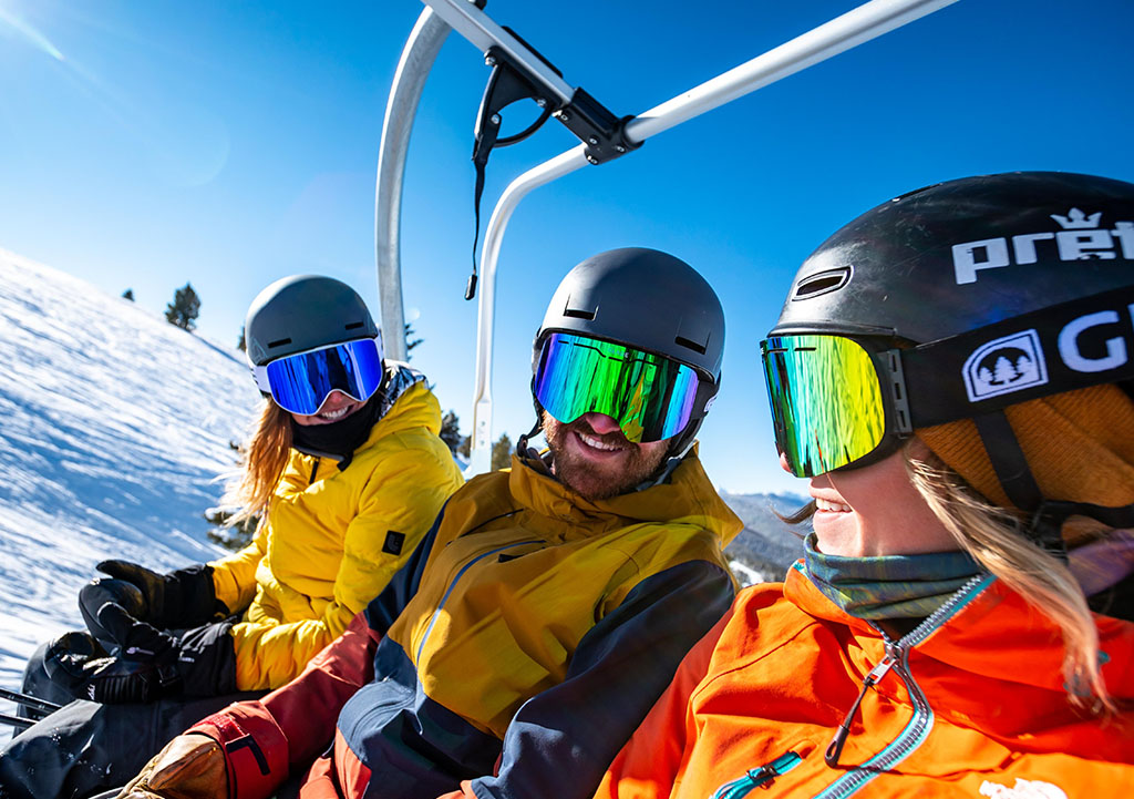 A group of friends on ski lift.
