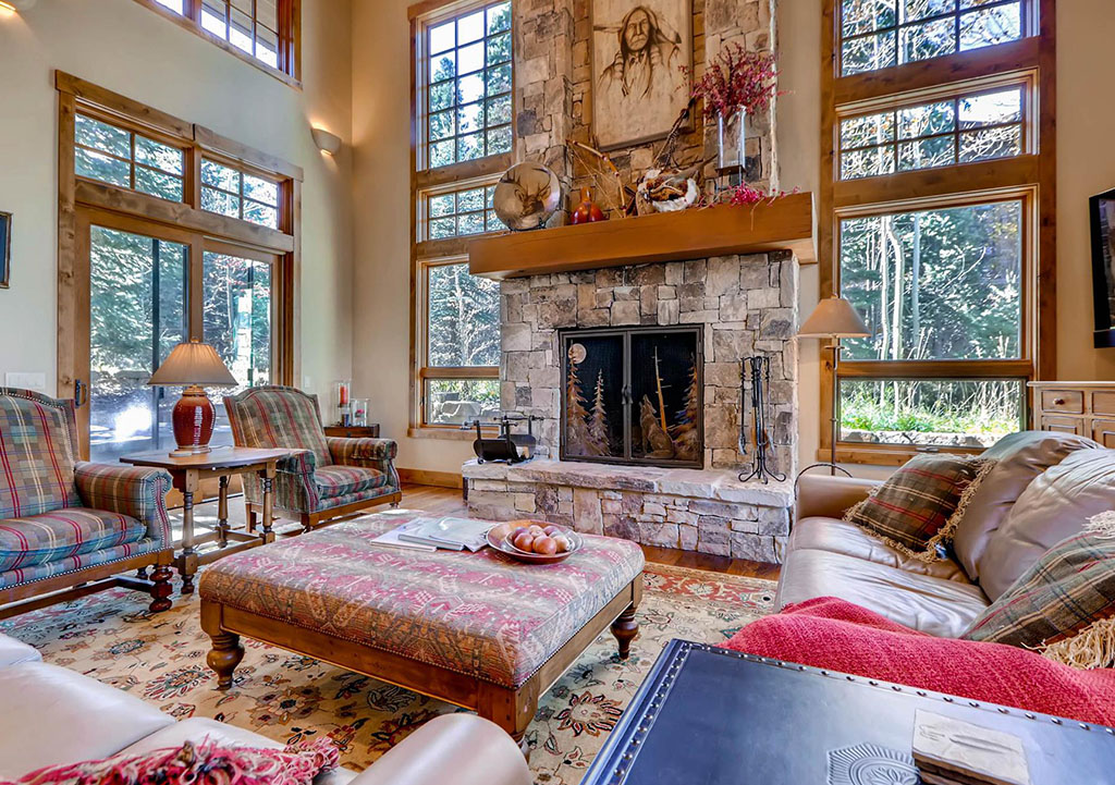Rustic living room with fireplace at the Red Pine Residence.
