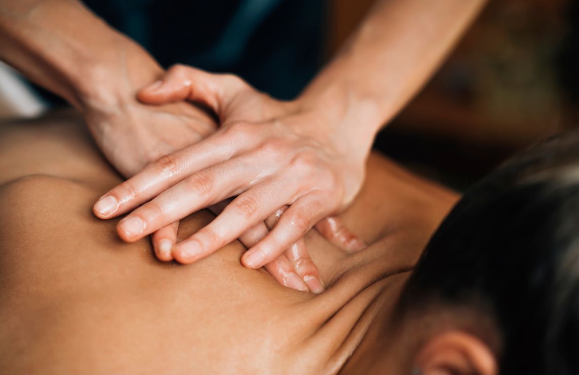 Person getting a massage on their back.