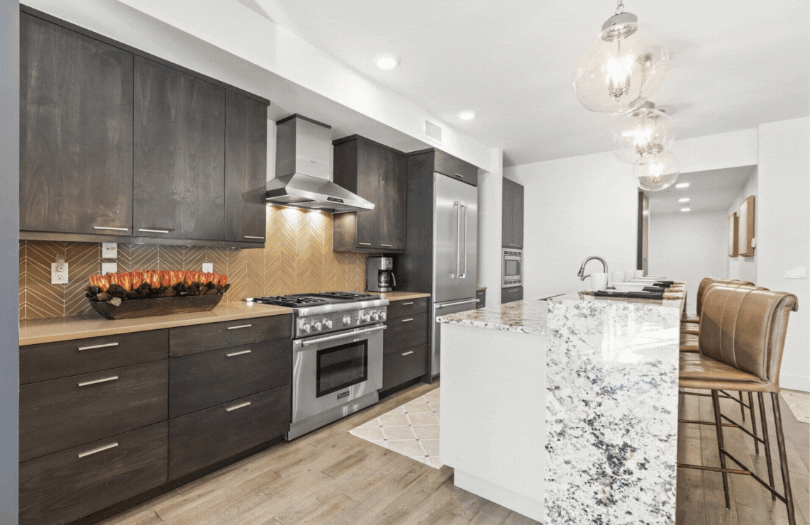 820 Park Avenue Unit #203 bedroom and contemporary kitchen, luxurious bedroom, and living room with gas fireplace.