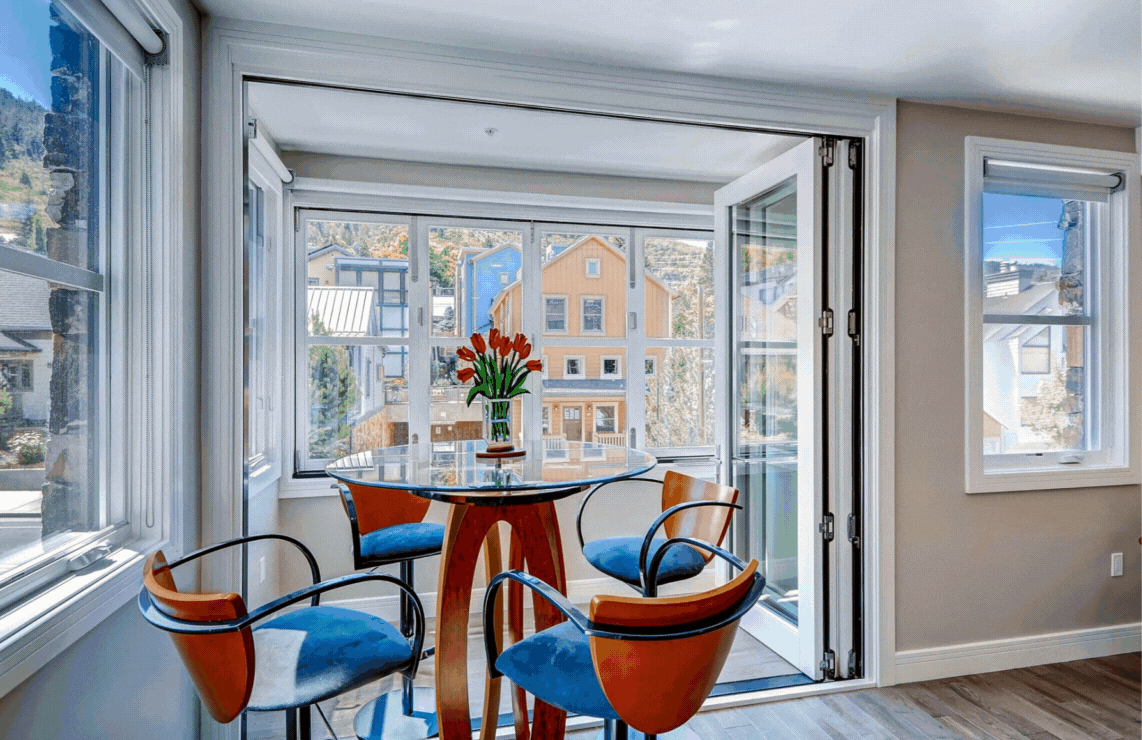 820 Park Avenue Unit #204 contemporary chef's kitchen, dining area, bedroom, and living room with comfy couches and gas fireplace.