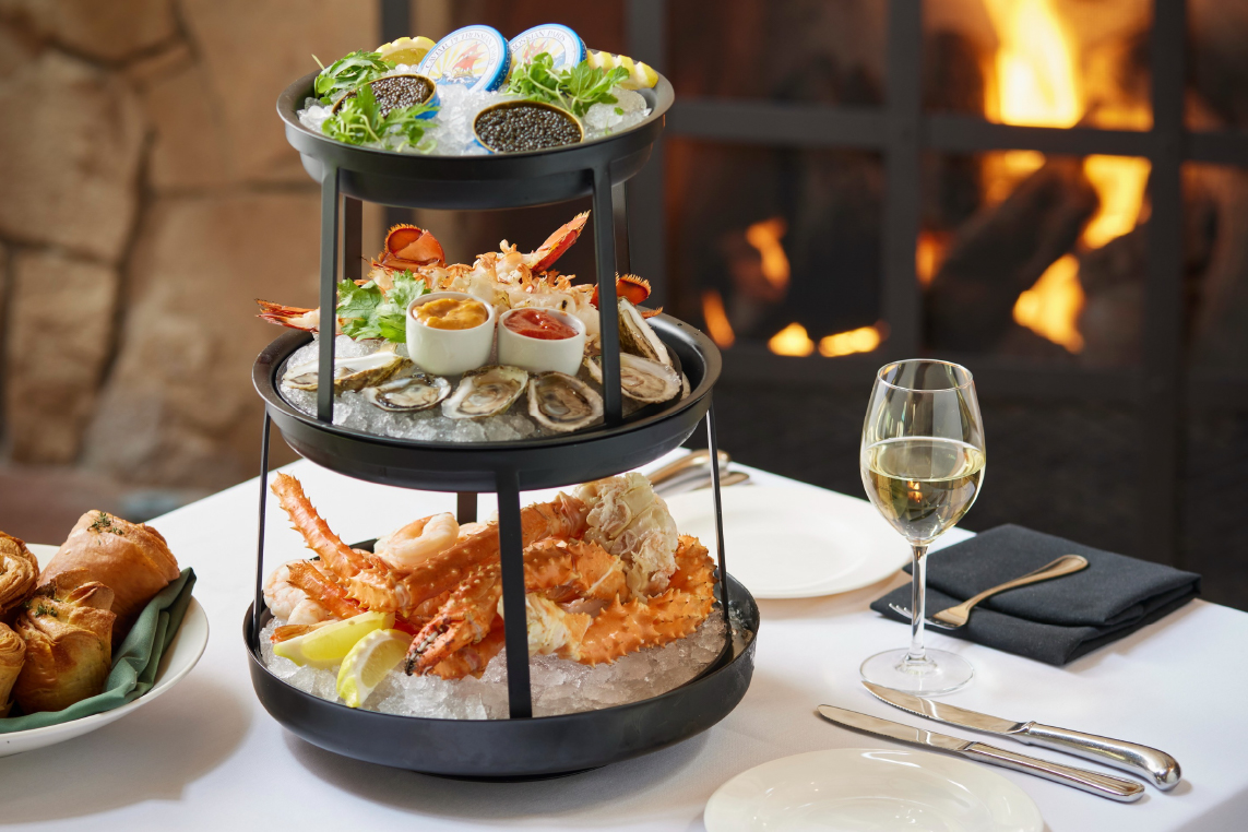 Seafood tower at a fine dining restaurant in Park City includes lobster, oysters, caviar, and more.